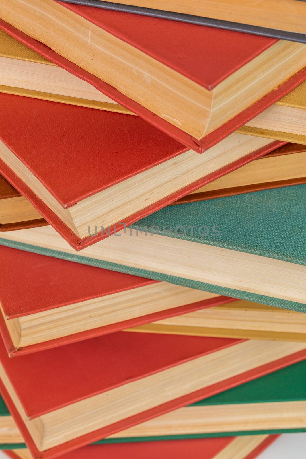 abstract books background - old red and muted green ones in a vertical stack.