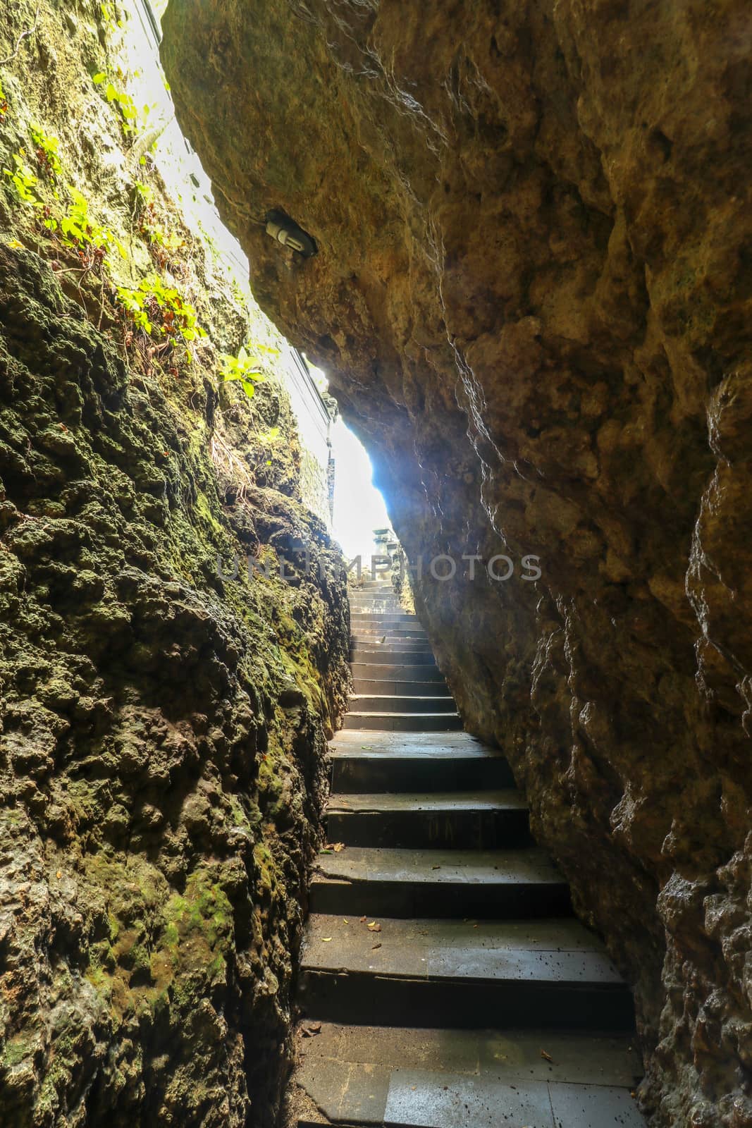 Stairs and a path in a rock around beautiful bay.