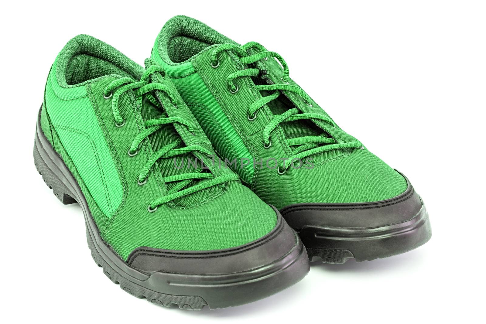 a pair of cheap light green hiking shoes isolated on white background - perspective close-up view by z1b
