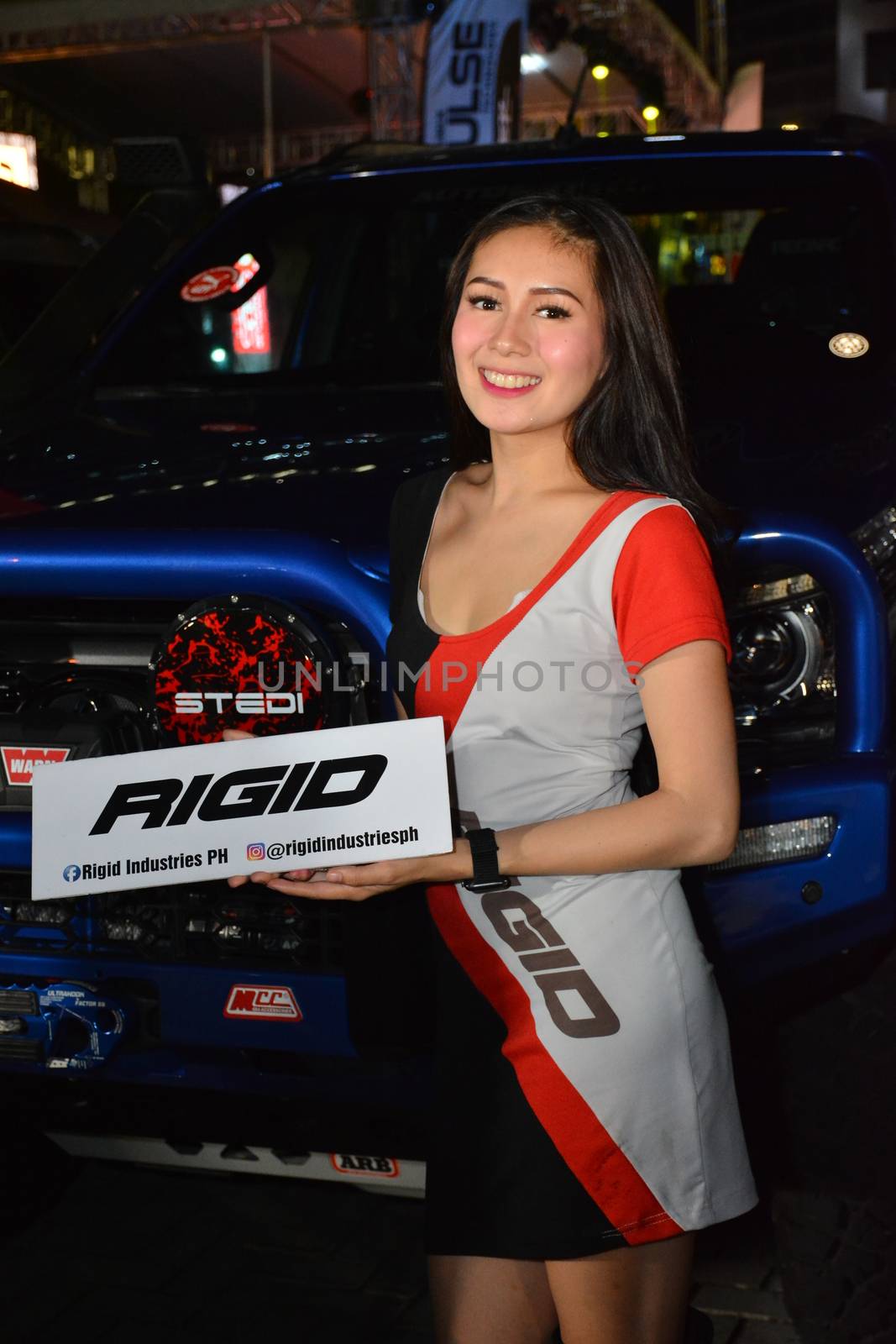 PASAY, PH - DEC. 7: Rigid Industries female model at Bumper to Bumper 15 on December 7, 2019 in Mall of Asia Concert Grounds, Pasay, Philippines. Bumper to Bumper is a annual aftermarket car show event in the Philippines.