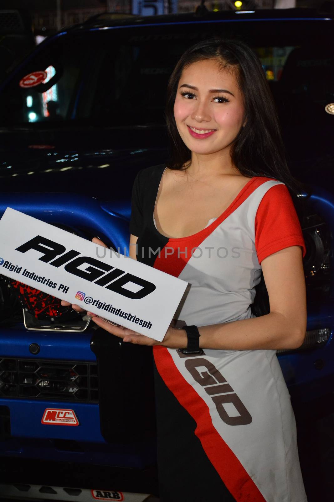 PASAY, PH - DEC. 7: Rigid Industries female model at Bumper to Bumper 15 on December 7, 2019 in Mall of Asia Concert Grounds, Pasay, Philippines. Bumper to Bumper is a annual aftermarket car show event in the Philippines.