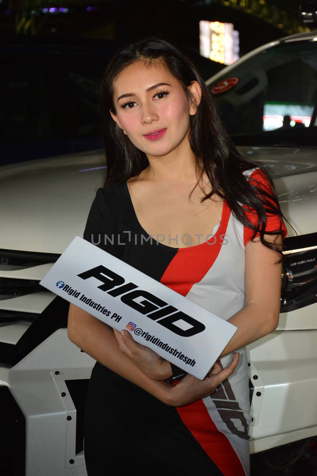 PASAY, PH - DEC. 7: Rigid Industries female model at Bumper to Bumper 15 on December 7, 2019 in Mall of Asia Concert Grounds, Pasay, Philippines. Bumper to Bumper is a annual aftermarket car show event in the Philippines.