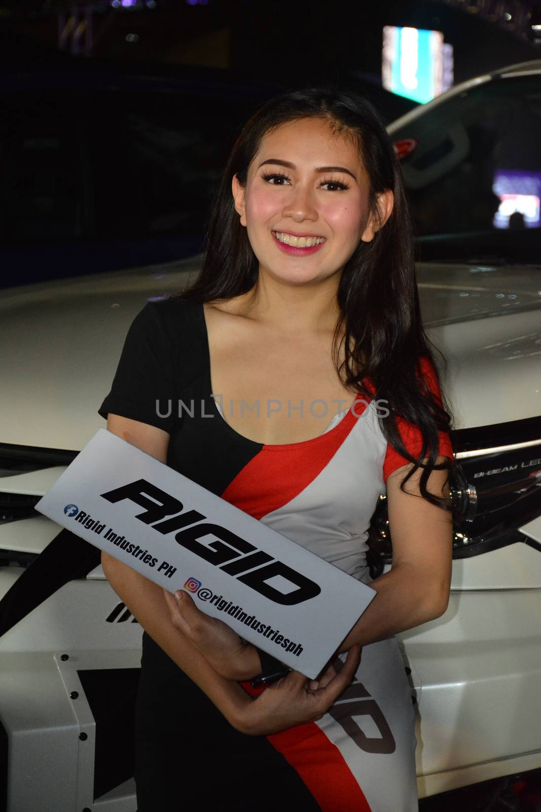 PASAY, PH - DEC. 7: Rigid Industries female model at Bumper to Bumper 15 on December 7, 2019 in Mall of Asia Concert Grounds, Pasay, Philippines. Bumper to Bumper is a annual aftermarket car show event in the Philippines.