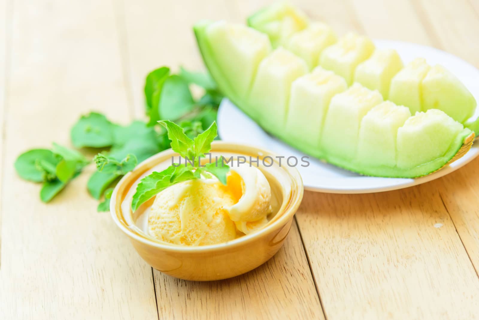 ice cream melon on wood table by rukawajung