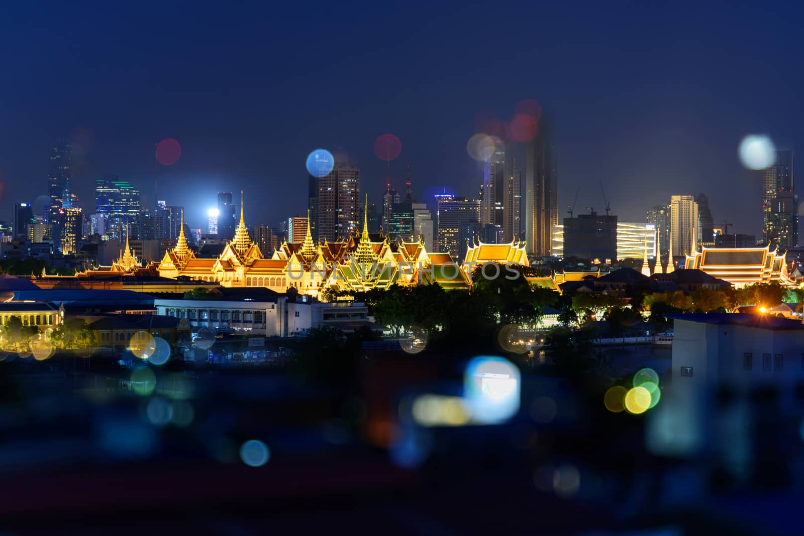 The grand palace of Thailand with high building behind by rukawajung