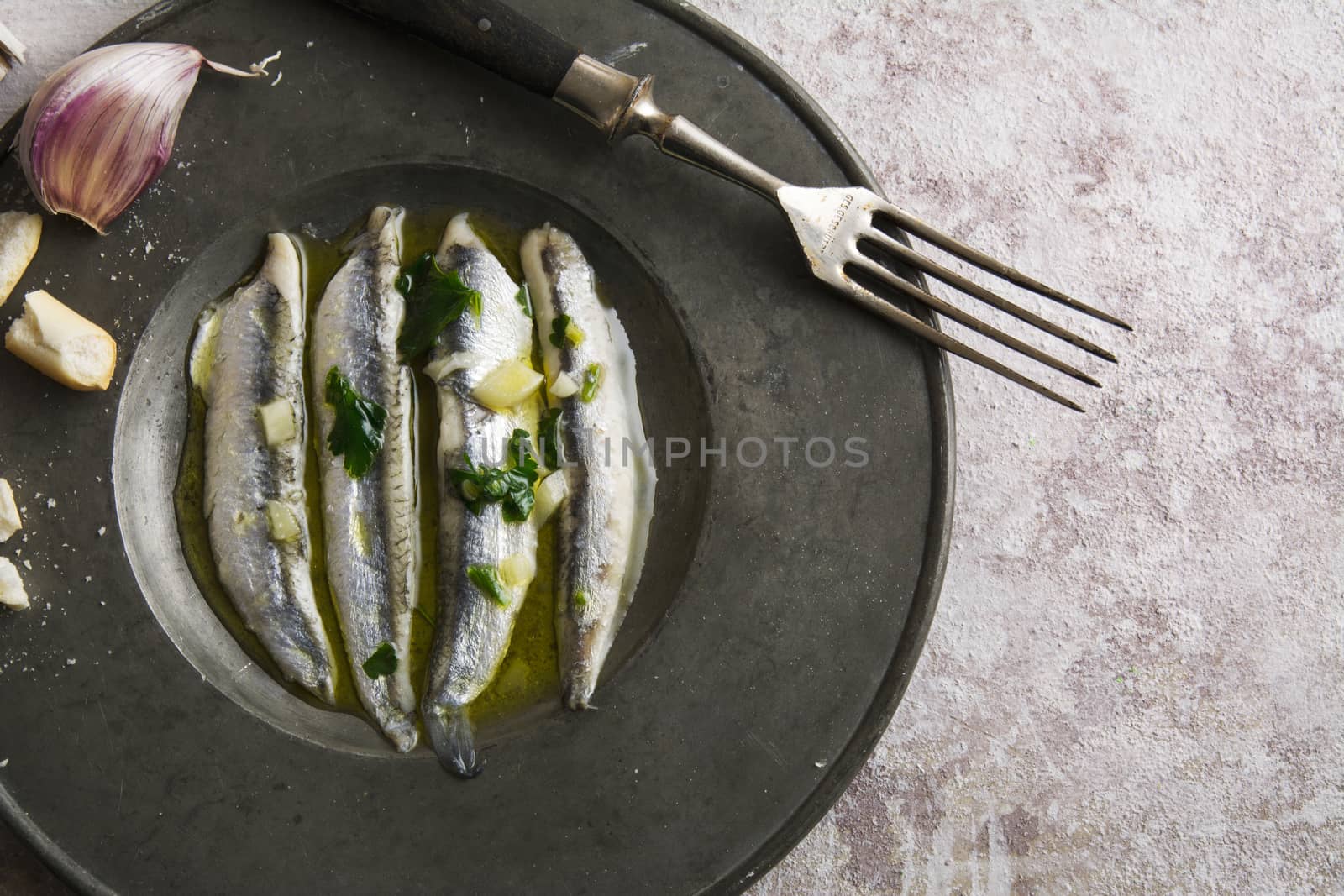 anchovies in vinegar with garlic and olive oil