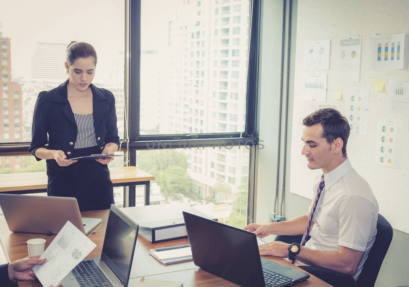 businesswoman presentation to a group in meeting.