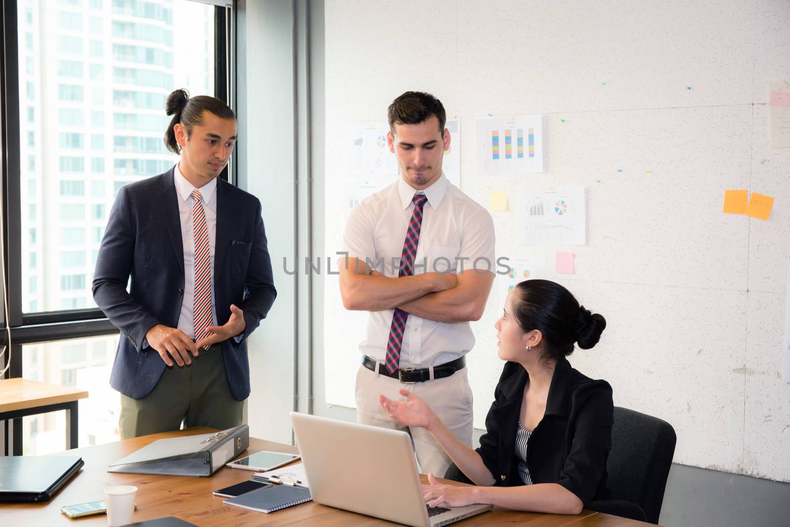 Business team having using laptop during a meeting and presents.