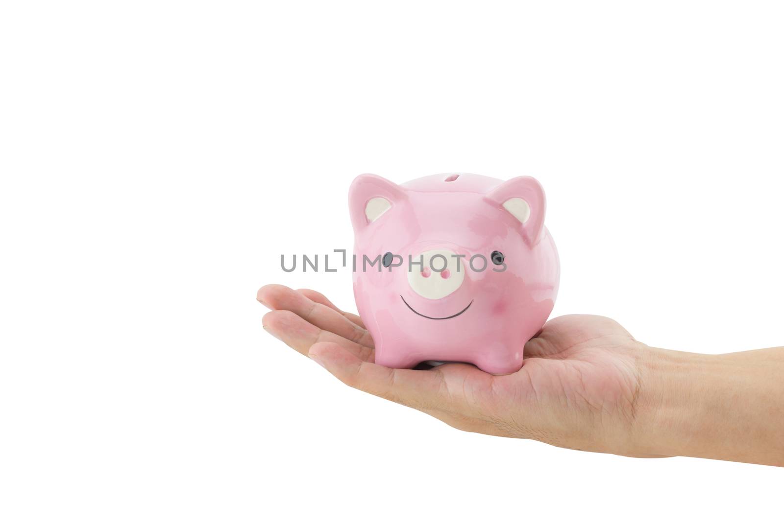 Business man holding a piggy bank isolated on white background.