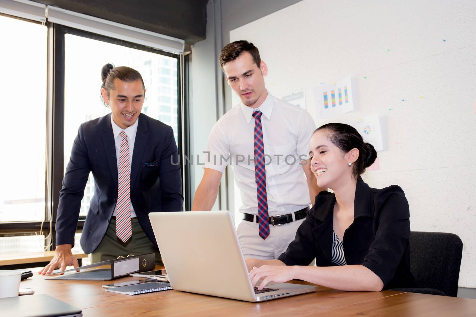 Business team having using laptop during a meeting and presents.