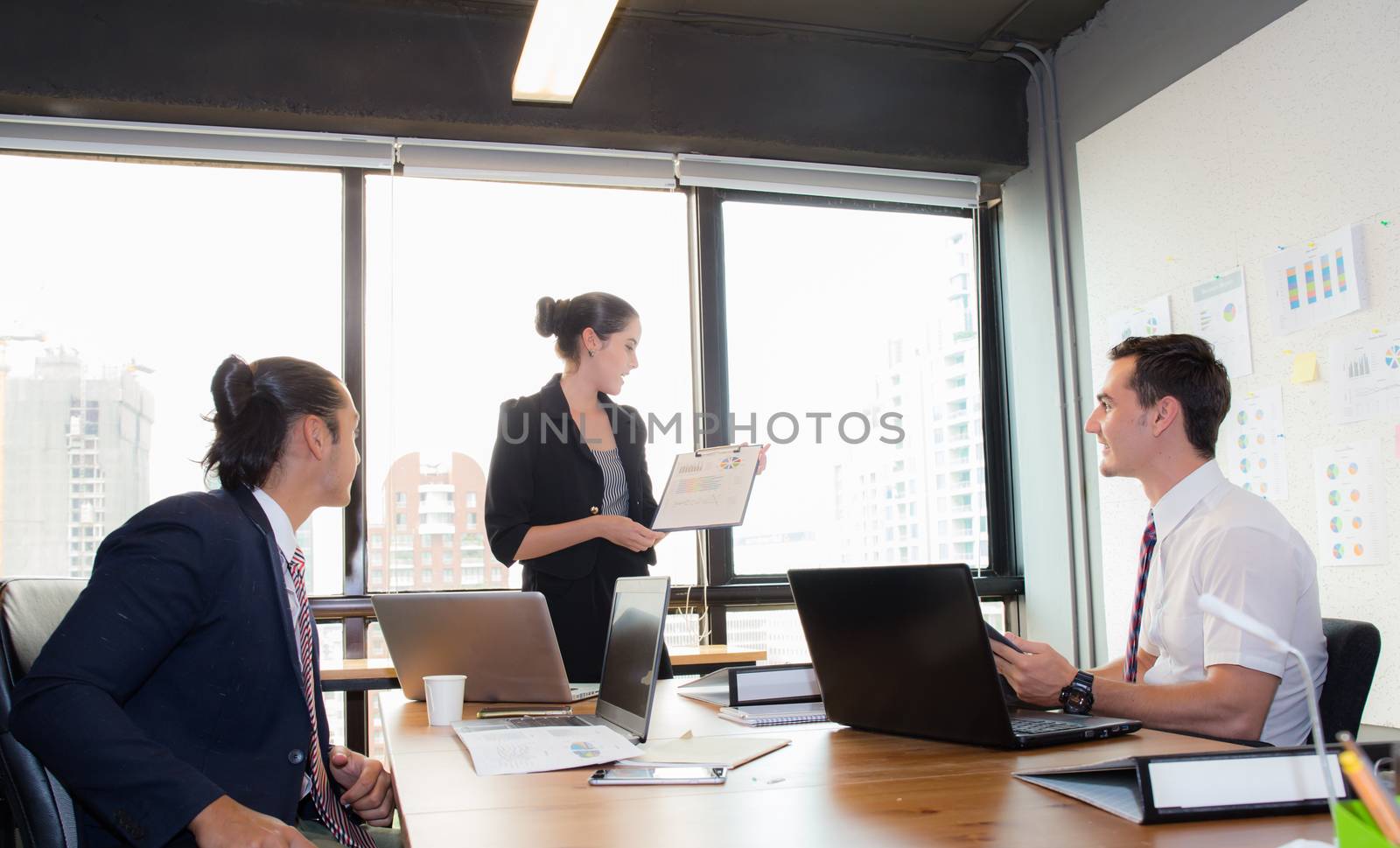 businesswoman presentation to a group in meeting.