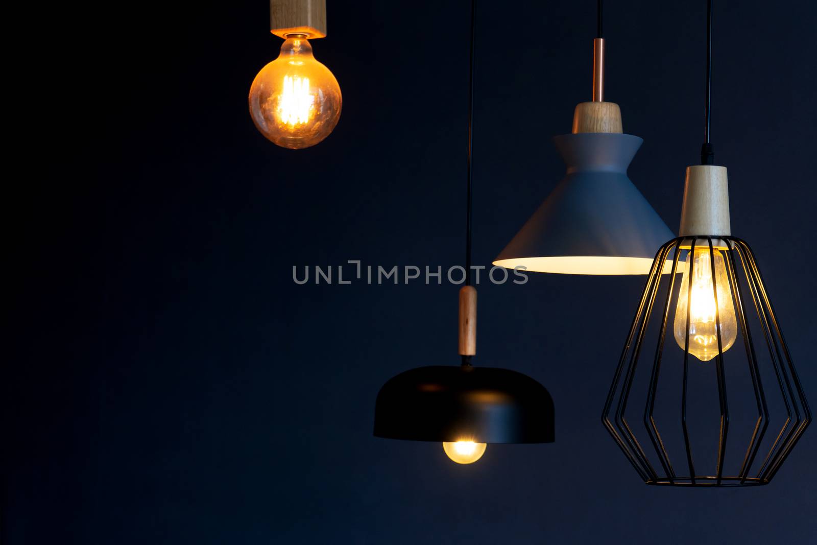 Interior decoration of stylish housing. Loft style incandescent lamp. Modern style home design.