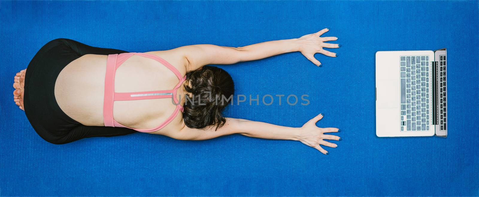 Banner Asian woman practicing yoga from home with laptop when Covid19 outbreak, healthy or Meditation Exercise, workout at home, coronavirus pandemic and quarantine, sports and healthcare in concept