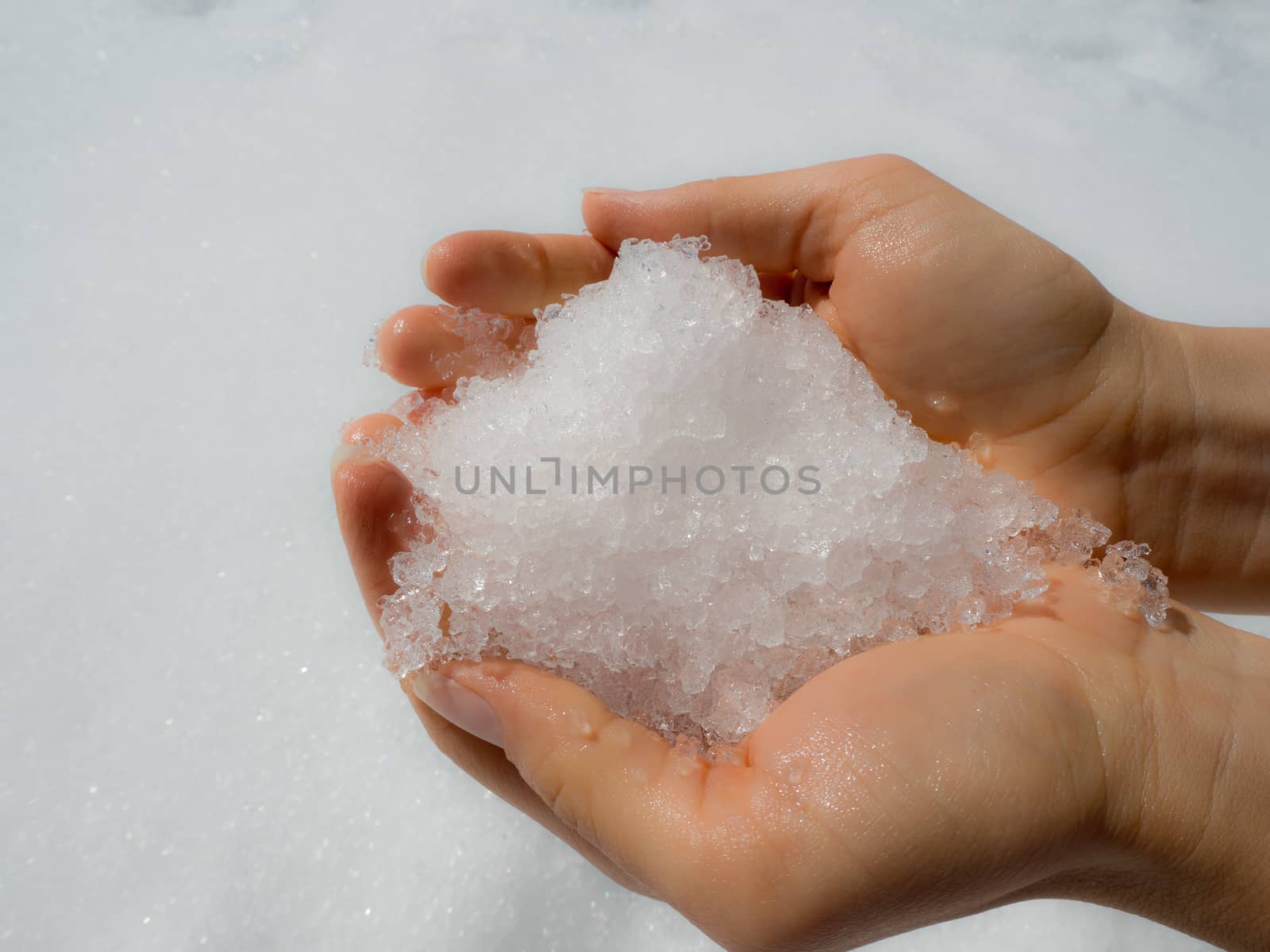 Winter feeling. Holding snow in your hands.