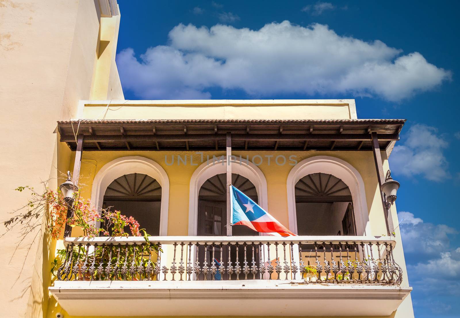 Apartment Building with San Juan Flag by dbvirago