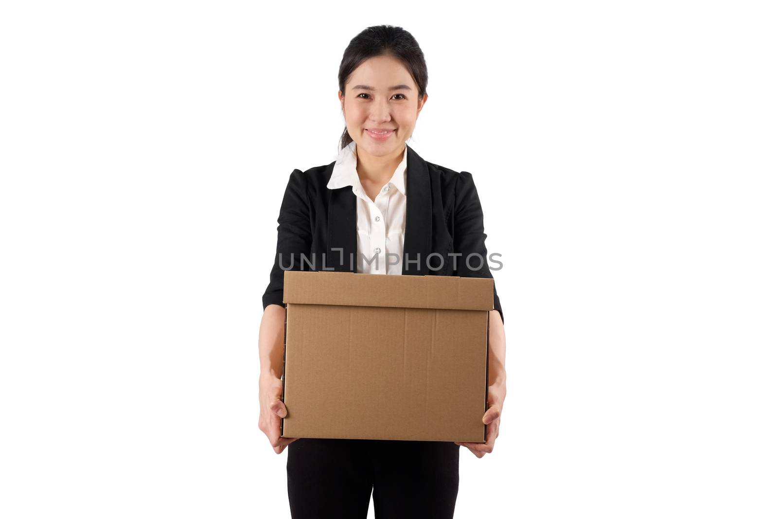 A young woman carrying a box