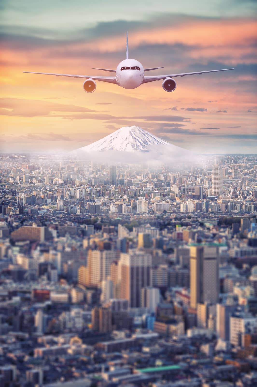 Retouch Mt.Fuji covered with snow and Japan cityscape with airplane on the sky in twilight 
