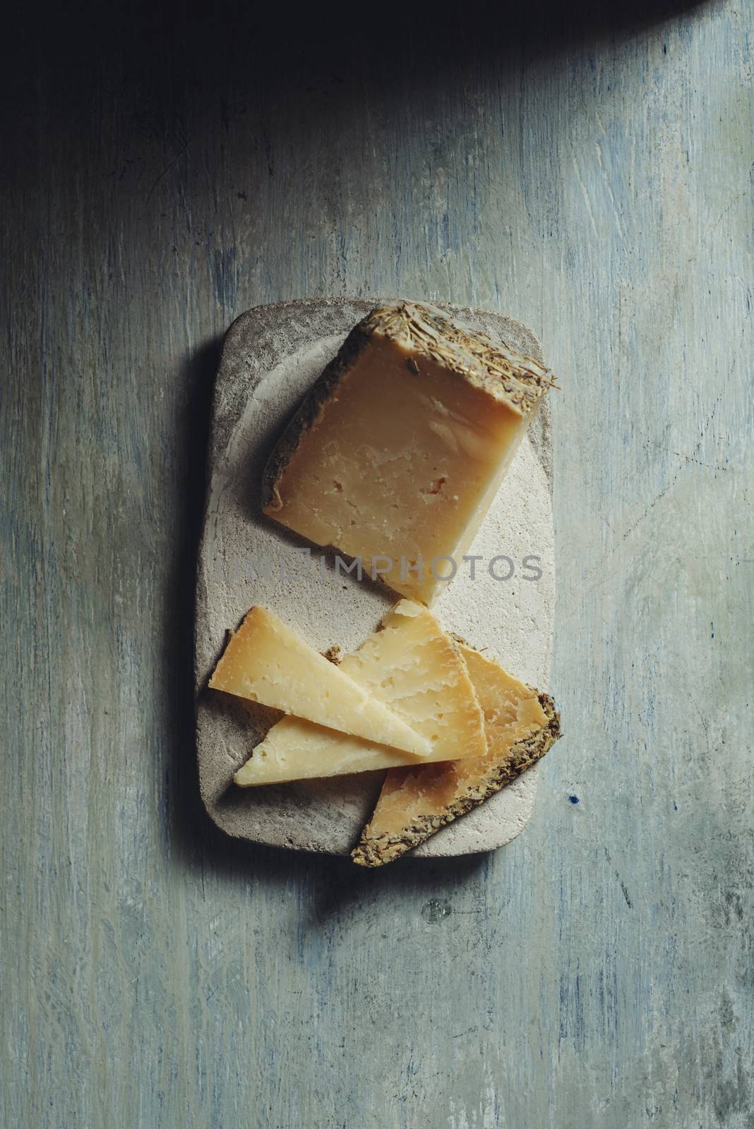 Semi-cured cheese "Villarejo Rosemary", made with raw sheep's milk and cured in Iberian lard and Romero. gold medals at the World Cheese Awards and the prize for the best cheese in the world at the Rome contest