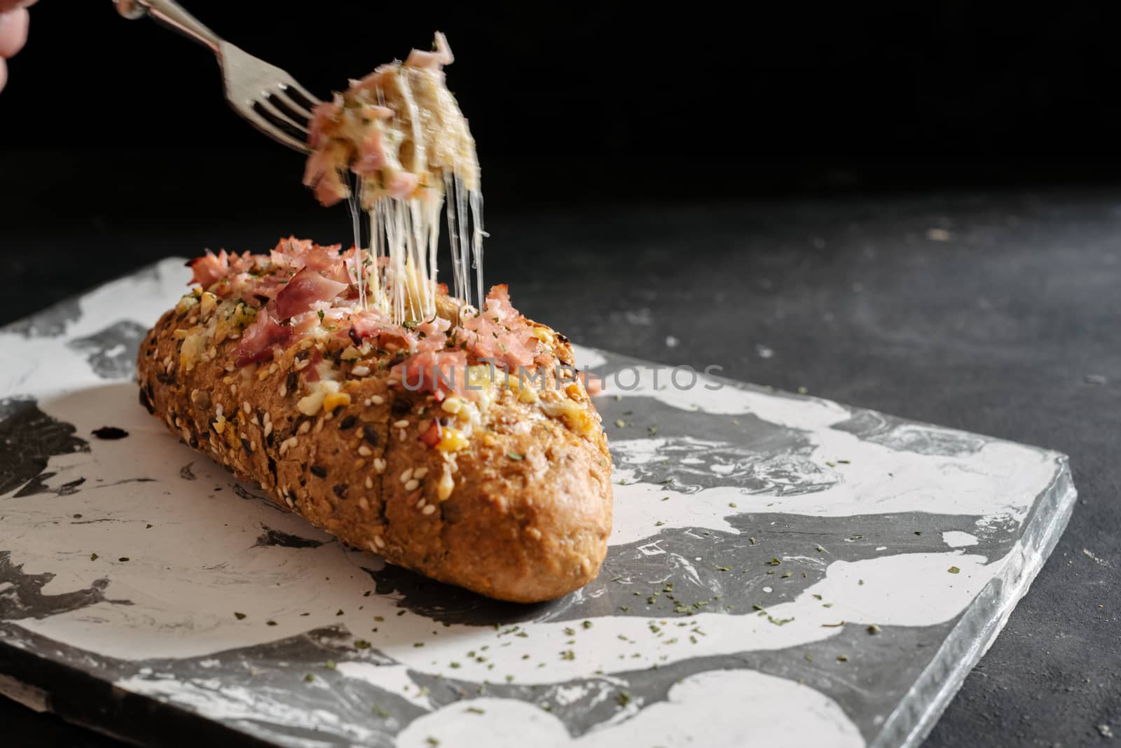 Fresh baked cheesy pull apart bread, with garlic, olive oil and herbs butter