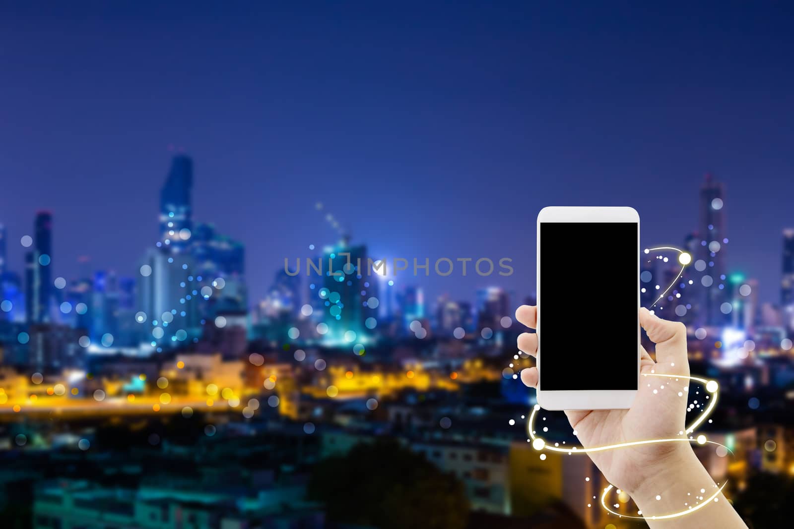 hand of businessman holding smart phone above network connection - technology communication concept.