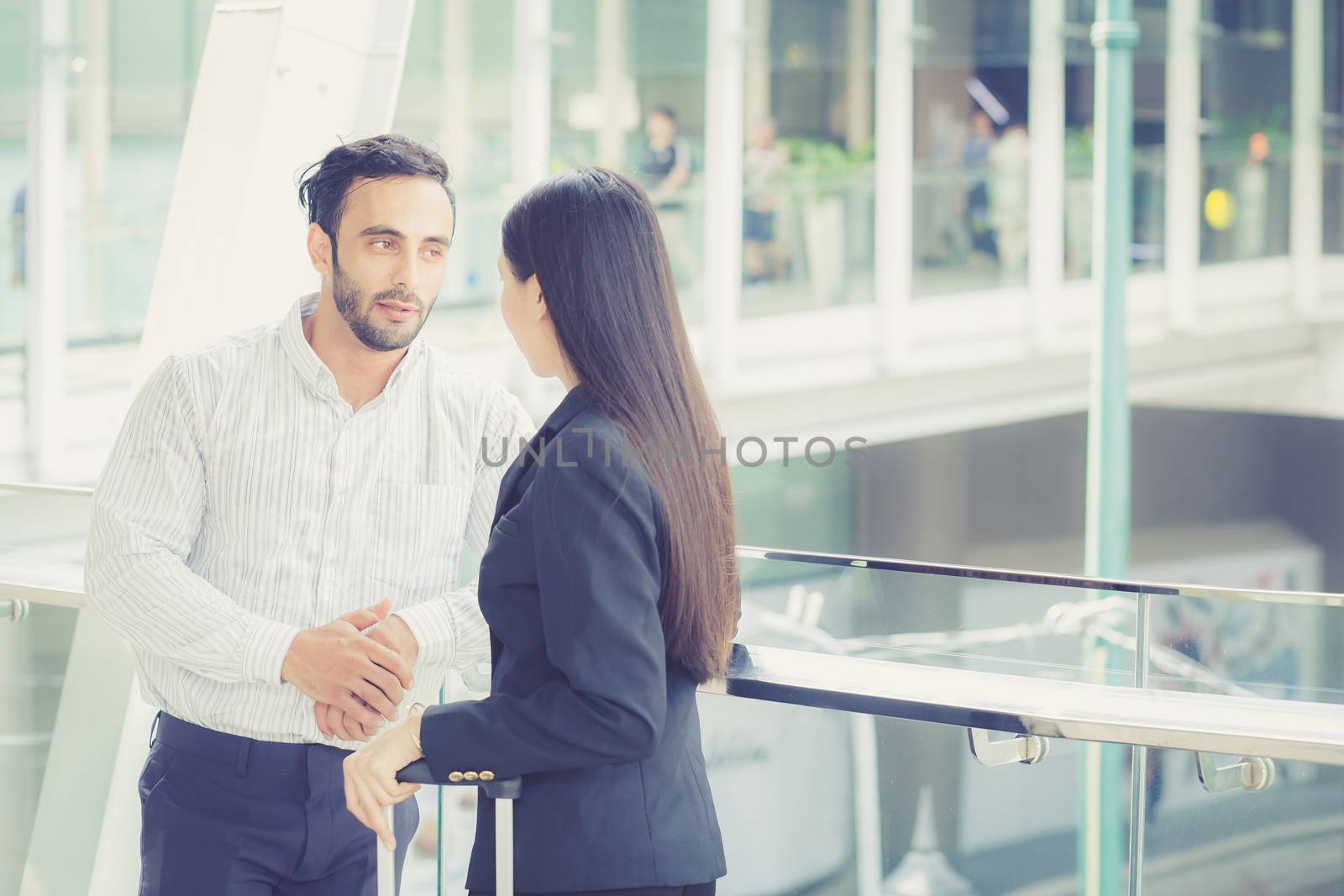 Businesswoman talking business partner standing conversation about the work, boss discussing with employee.
