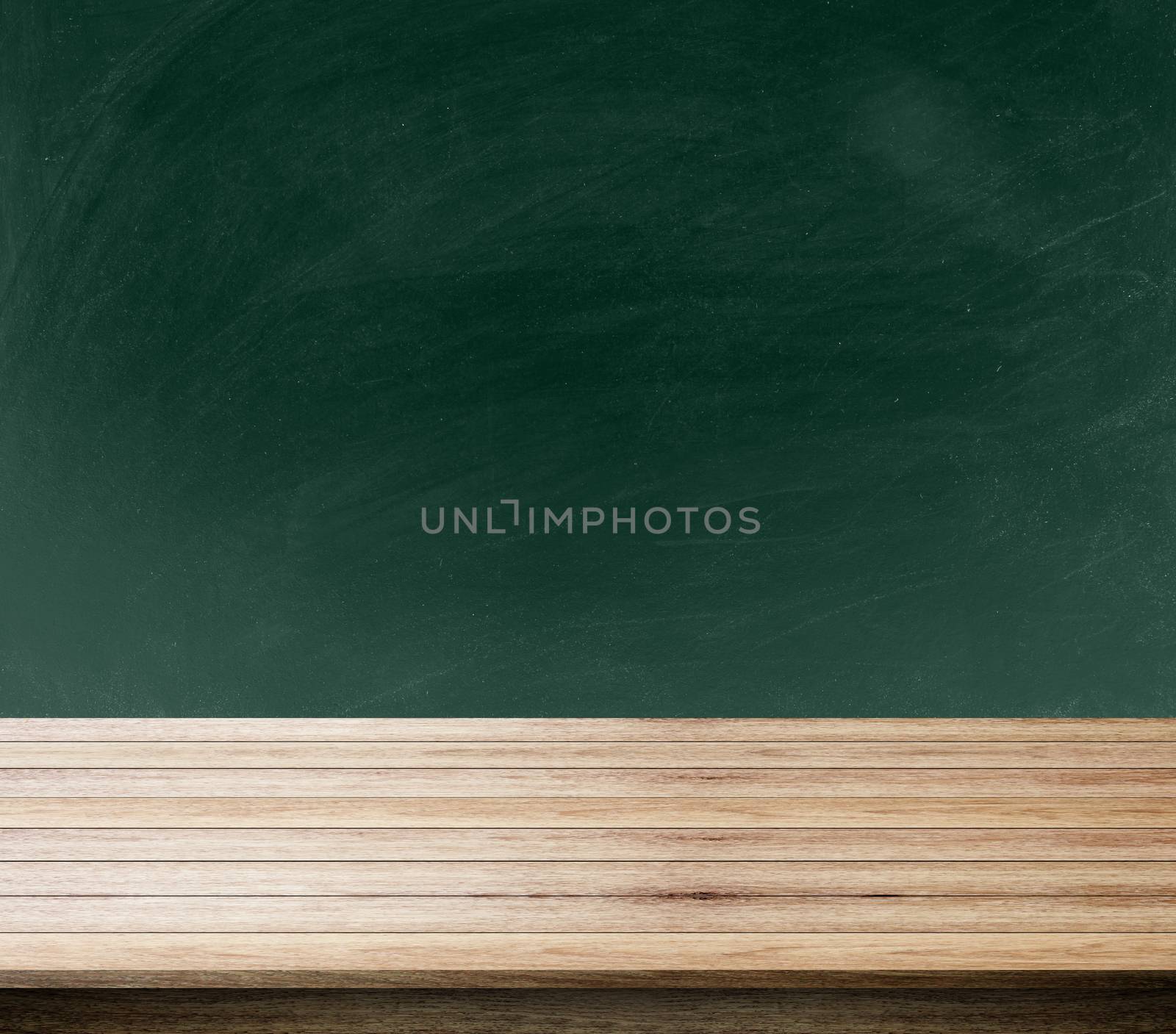 green background of blackboard, chalkboard and free space for you and desk space, can be used for display your products.