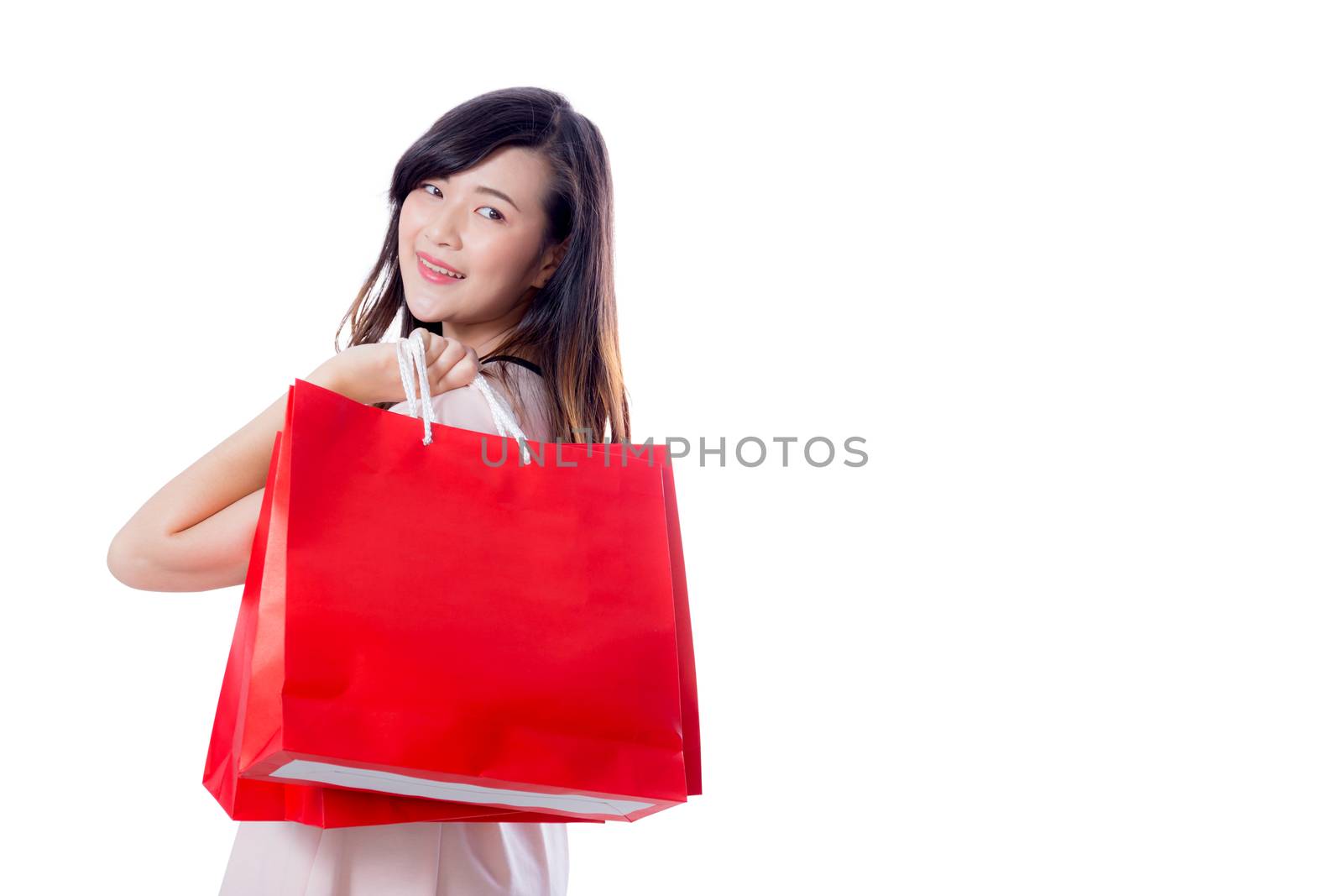 beautiful smiling asian young women with shopping sale bags isolated on white background.