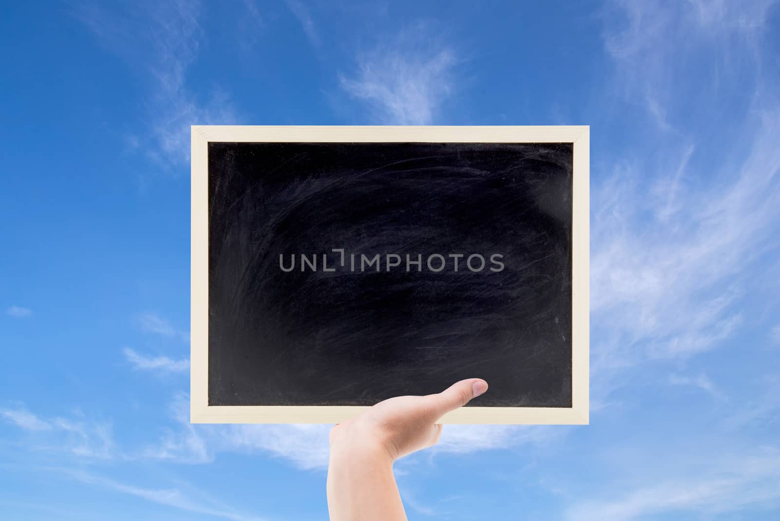 chalkboard space can be used for on text your. and blue sky background.