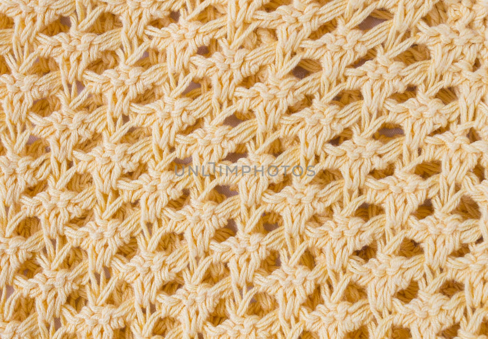 Dark Yellow Knitting Texture or Knitted Texture Background in macro style. Knitting Texture or Knitted Texture in vintage style for design