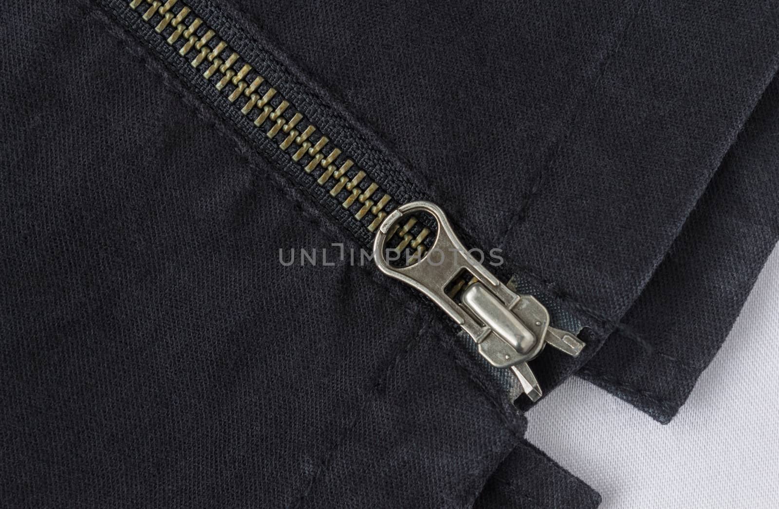 End of Closed Brass Zip on Black Jeans Texture Background. Closed Brass Zip on Black Jeans Texture Background for Apparel Design