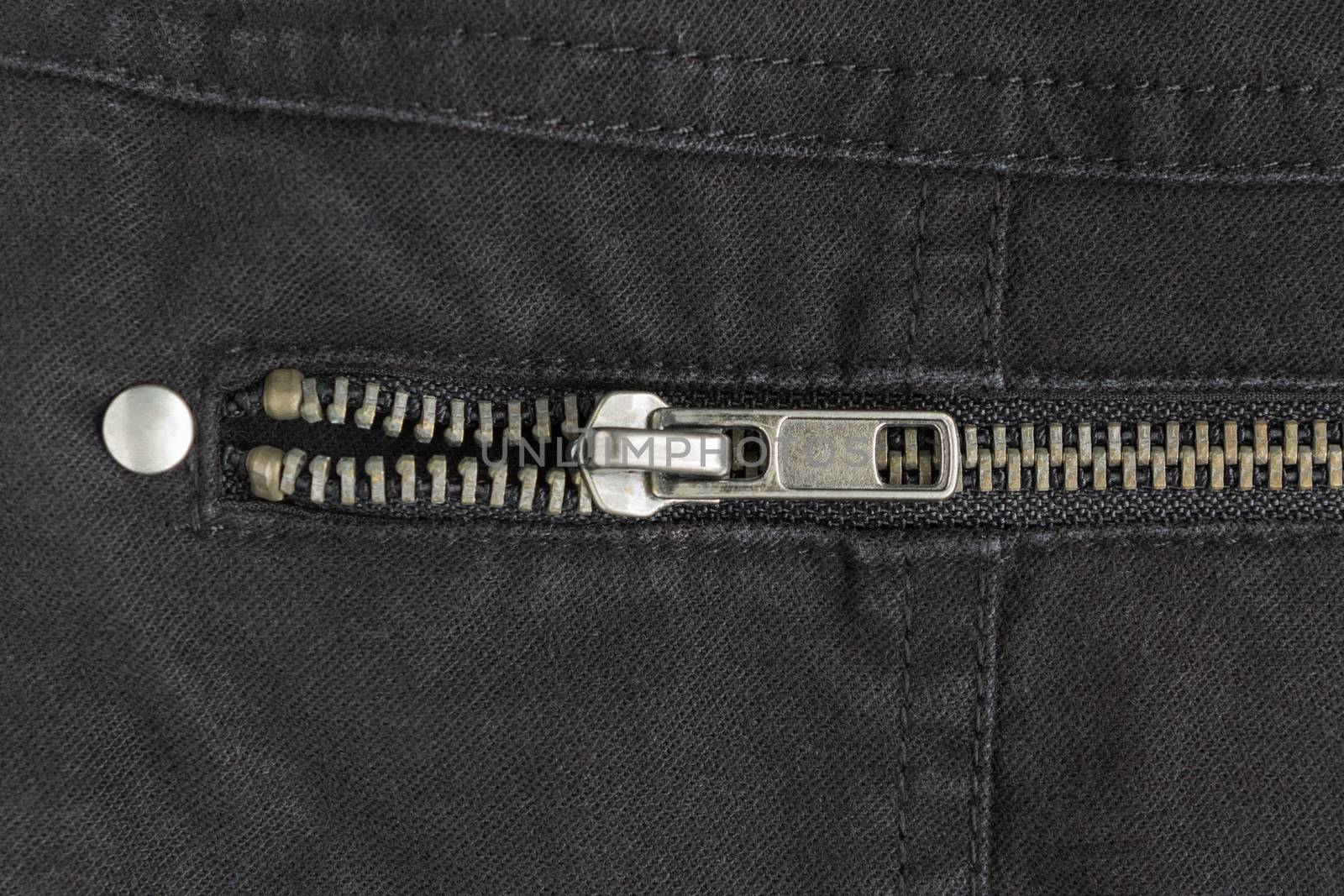 Open Brass Zip on Black Jeans Texture Background. Closed Brass Zip on Black Jeans Texture Background for Apparel Design