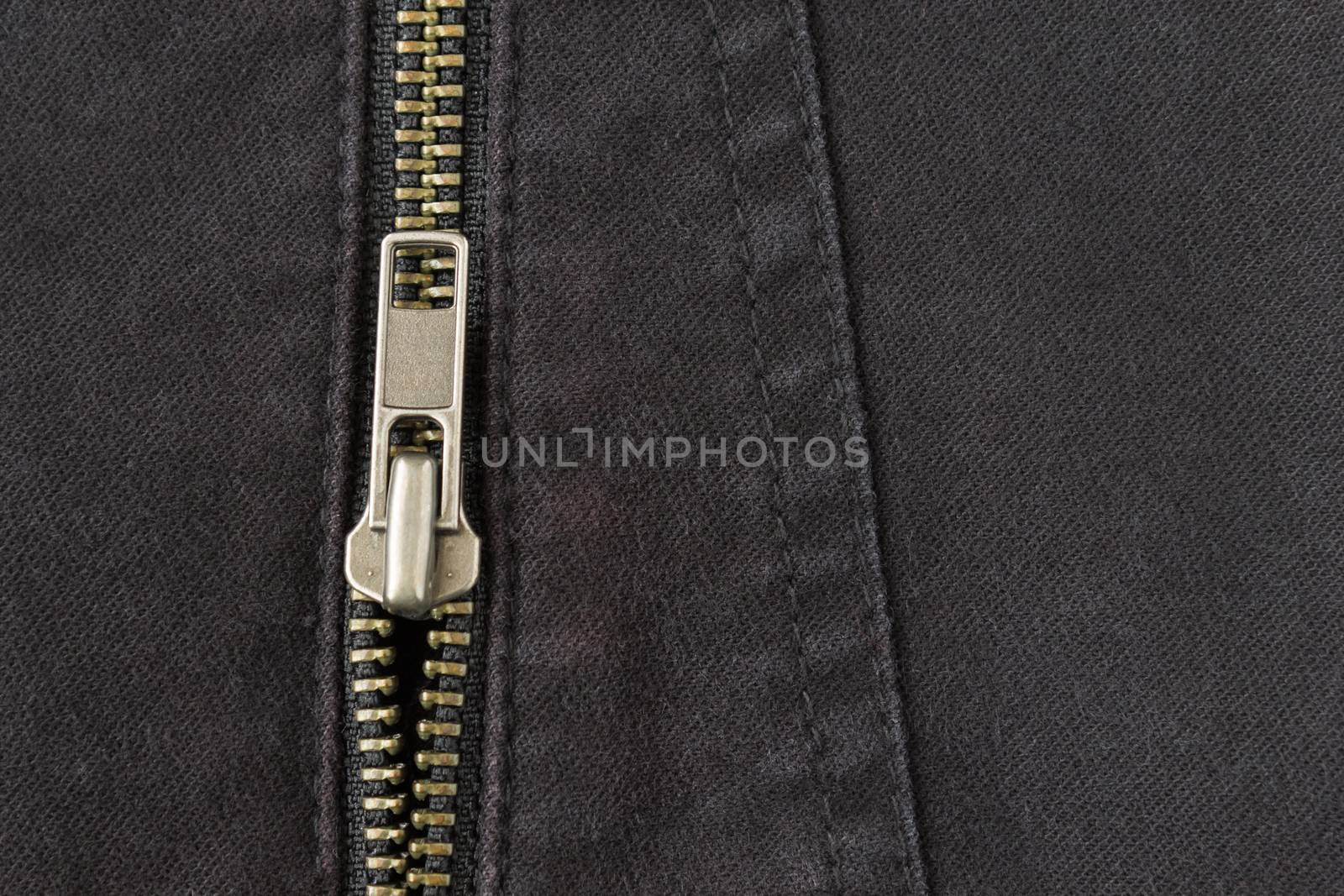 Open Brass Zip on Black Jeans Texture Background. Open Brass Zip on Black Jeans Texture Background for Apparel Design