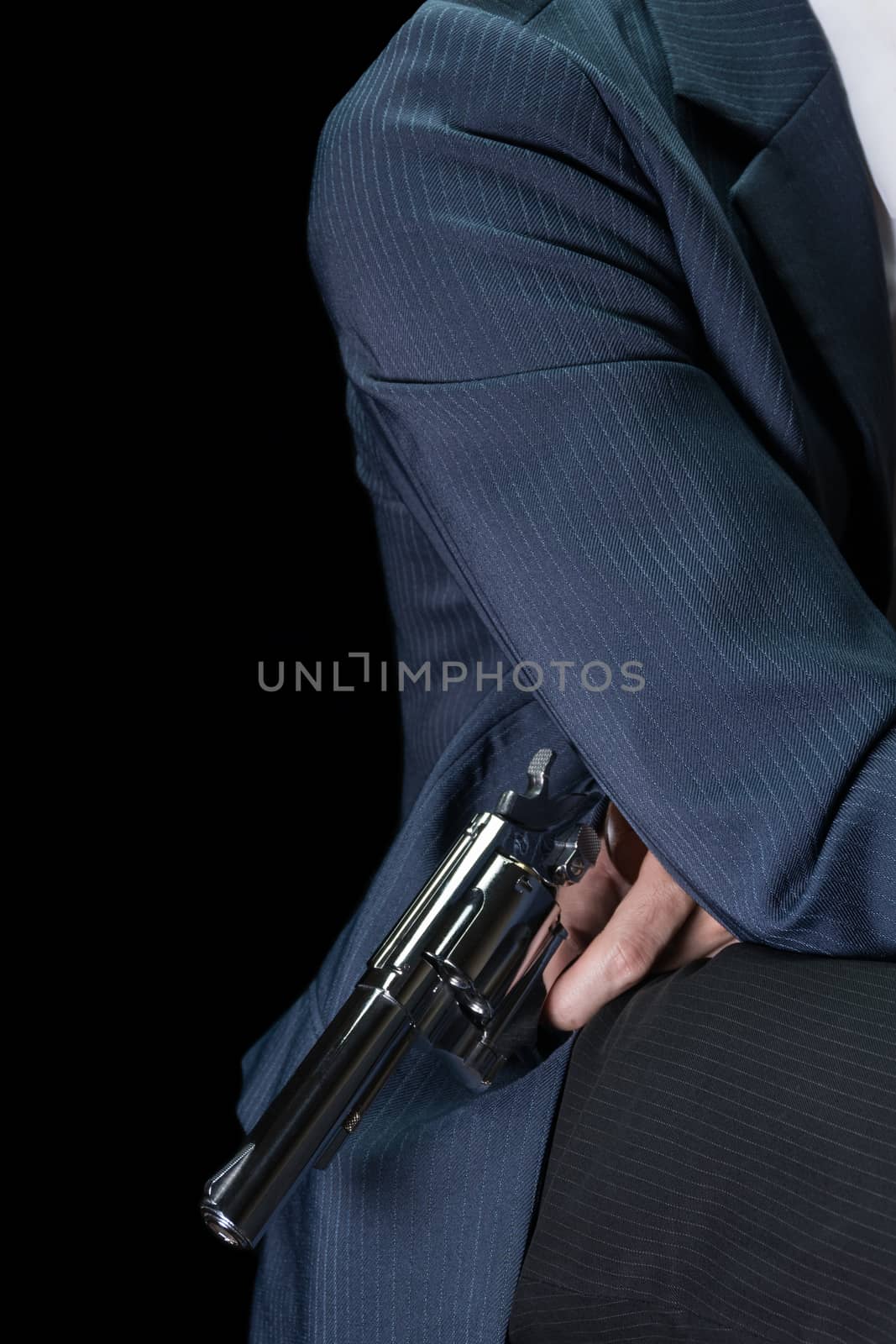 Man Hold Stainless Gun or Shooter in Hand Side Body Shoot Below in Book Cover Style. Fake Stainless Gun or Shooter in Hand portrait view for criminal or violence concept