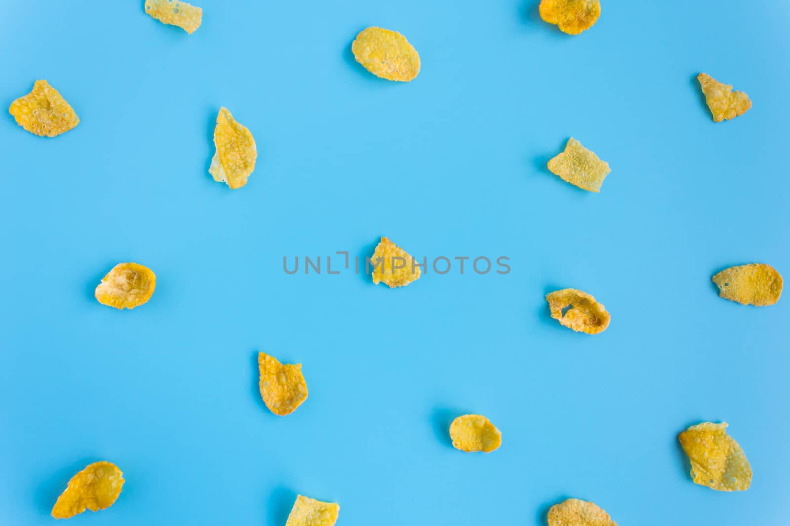 Cornflakes on Blue Pastel Background Minimalist. Cereal Breakfast healthy clean food for food and dessert category