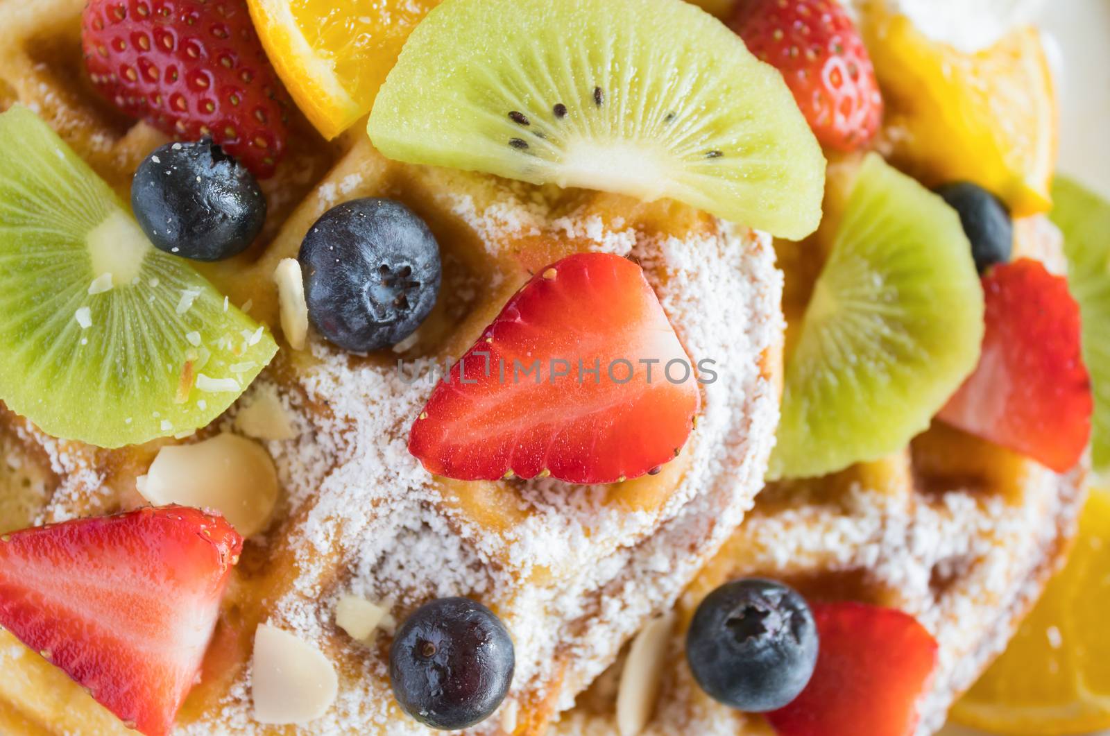 Flatlay Strawberry Blueberry Kiwi Lemon Waffle Dessert. Fruity dessert food and drink category