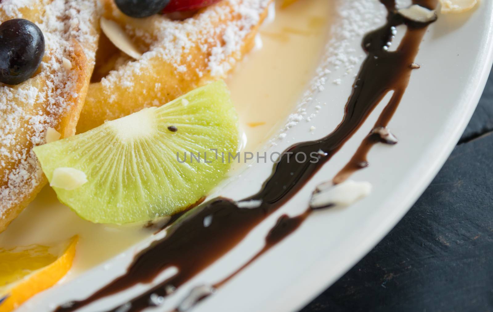 Kiwi Blueberry Lemon Waffle Chocolate Dessert. Fruity dessert for food and drink category