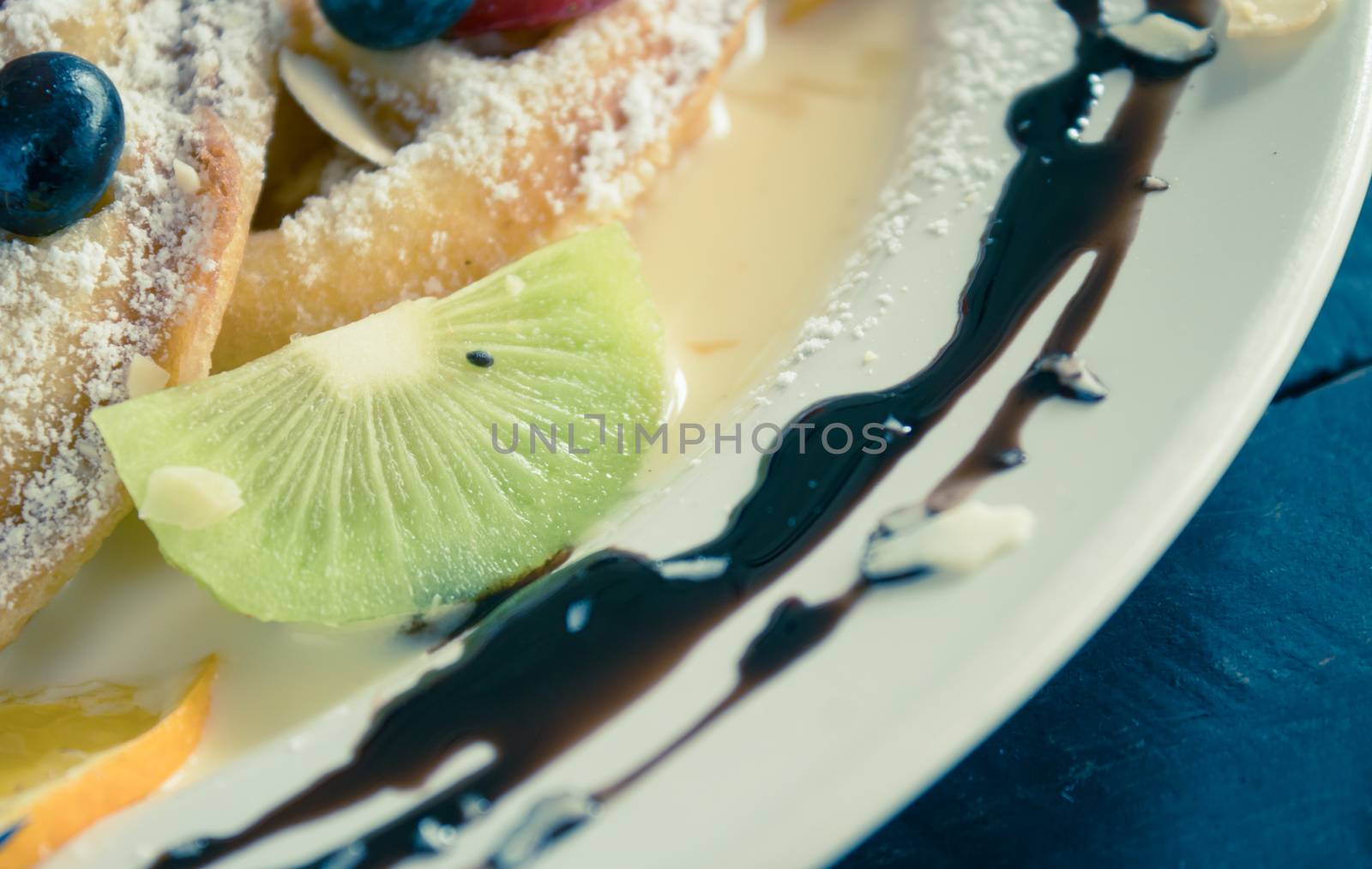 Vintage Kiwi Blueberry Lemon Waffle Chocolate Dessert. Fruity dessert for food and drink category