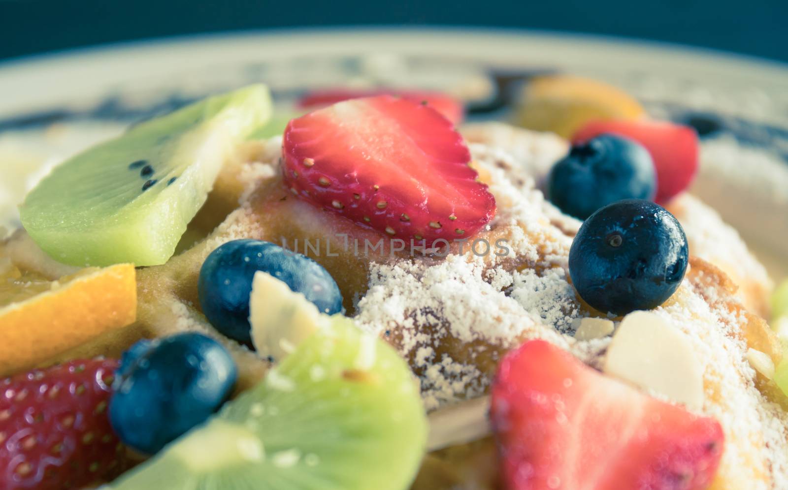 Vintage Strawberry Blueberry Kiwi Lemon Waffle Dessert. Fruity dessert food and drink category