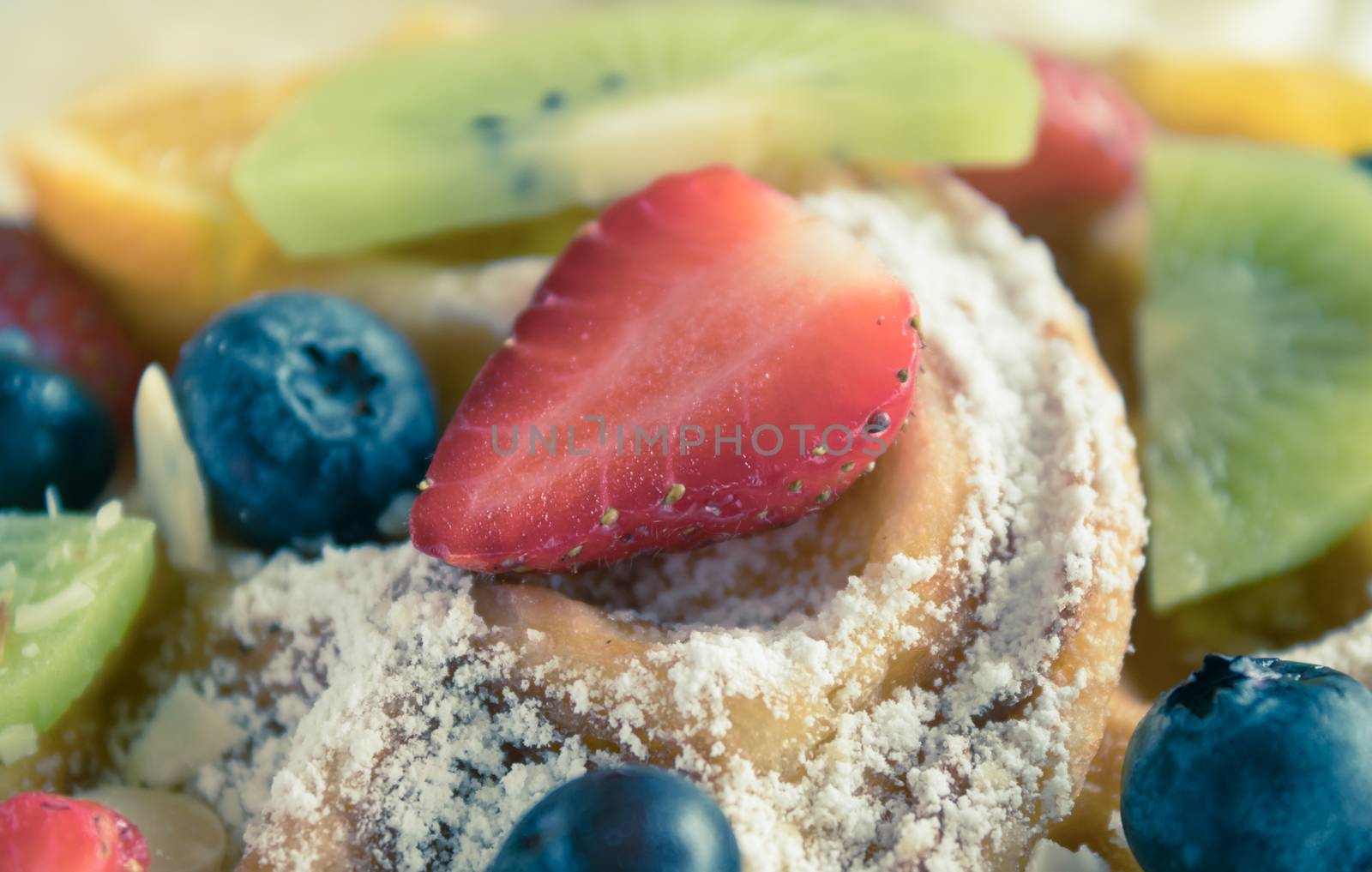 Vintage Strawberry Blueberry Kiwi Lemon Waffle Dessert Close Up. Fruity dessert food and drink category