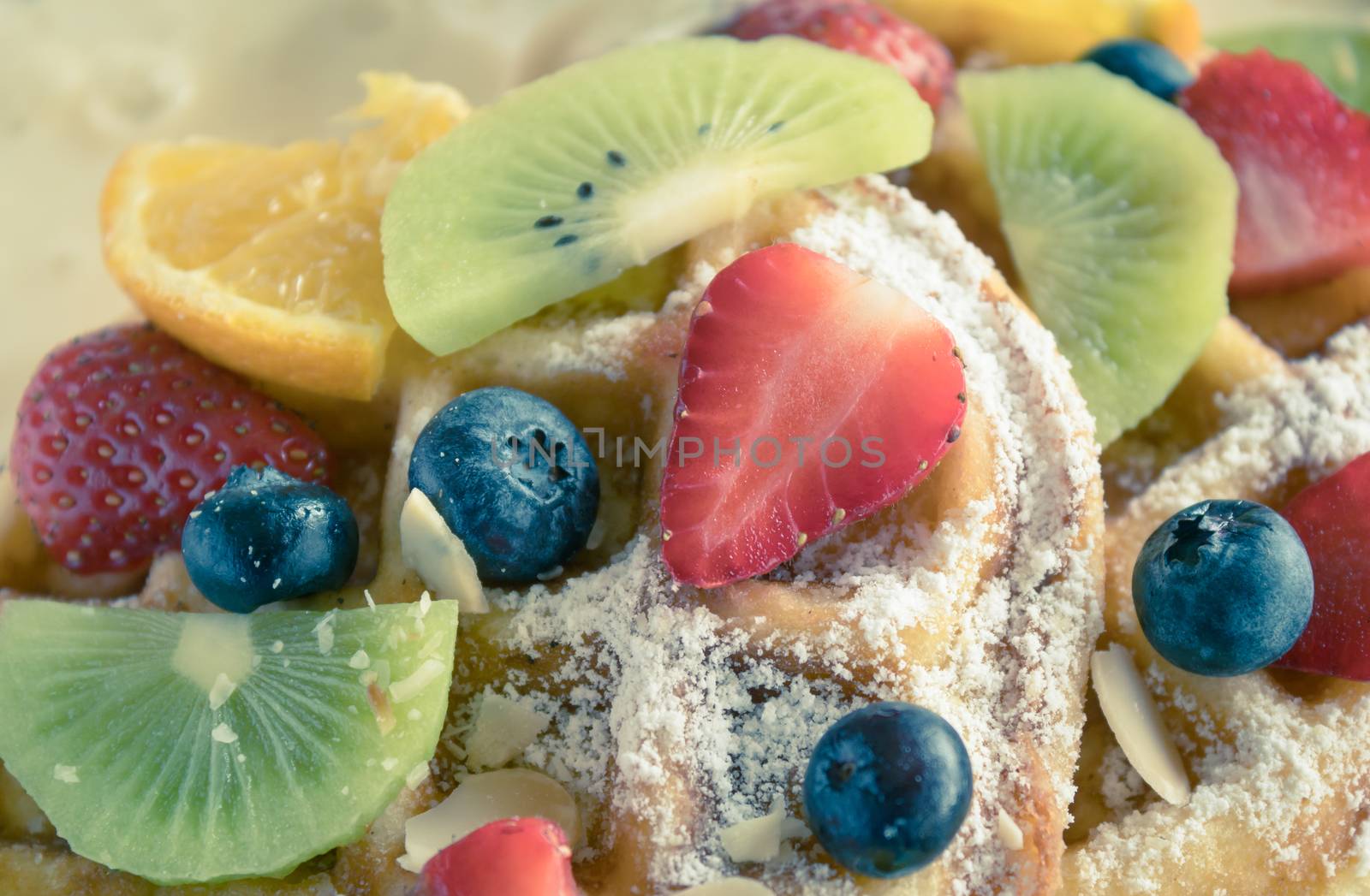 Vintage Strawberry Blueberry Kiwi Lemon Waffle Dessert Close Up. Fruity dessert food and drink category