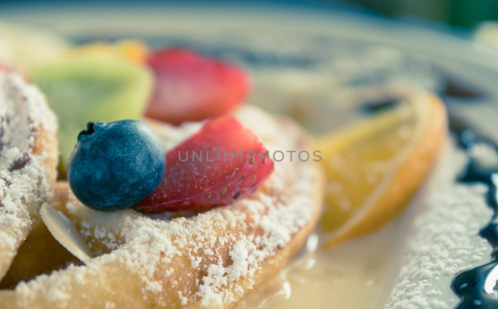 Vintage Blueberry Strawberry Kiwi Lemon Waffle Icing Sugar Chocolate Dessert. Fruity dessert food and drink category