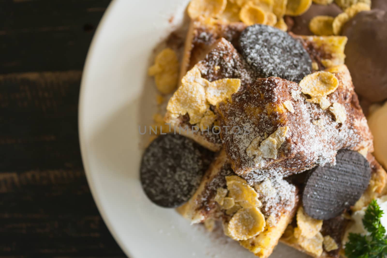 Sweet Toast Bread or Dessert and Cookies and Vanilla Chocolate Ice Cream and Cornflakes and Whipped Cream and Chocolate Cocoa Powder. Dessert toast bread for food and drink category