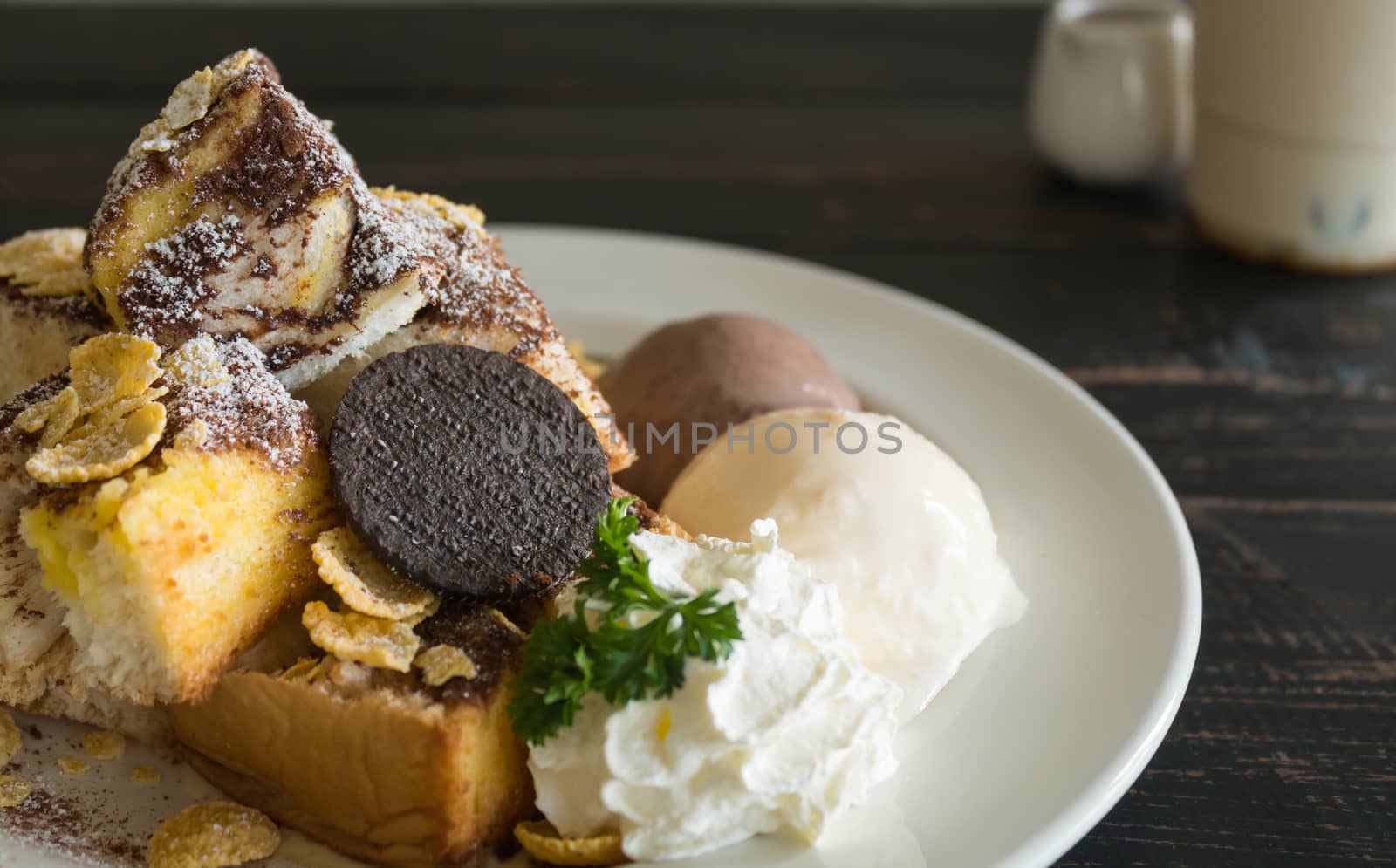 Sweet Toast Bread or Dessert and Cookies and Vanilla Chocolate Ice Cream and Cornflakes and Whipped Cream and Chocolate Cocoa Powder. Dessert toast bread for food and drink category