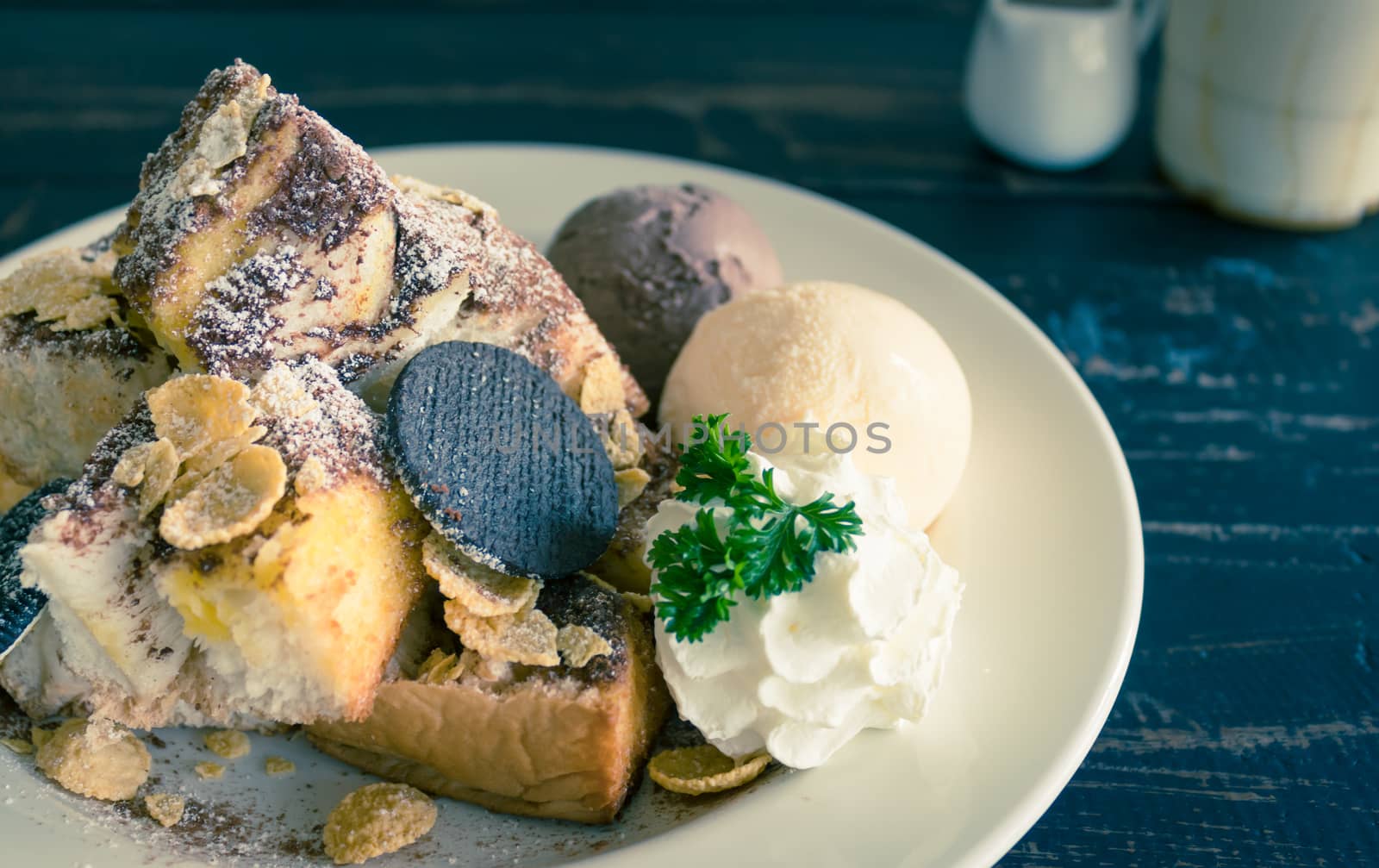 Sweet Toast Bread or Dessert and Cookies and Vanilla Chocolate Ice Cream and Cornflakes and Whipped Cream and Chocolate Cocoa Powder. Dessert toast bread for food and drink category