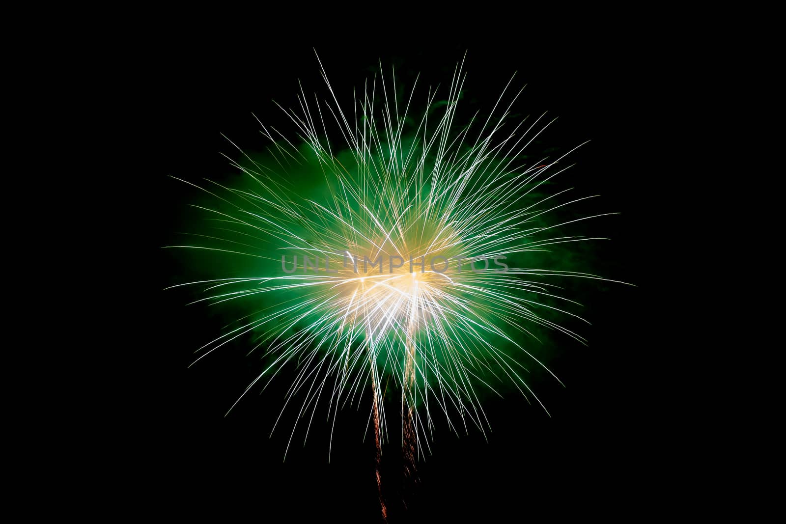 Green Yellow Sparkling Fireworks Background on Night Scene. Abstract color fireworks background and smoke on sky