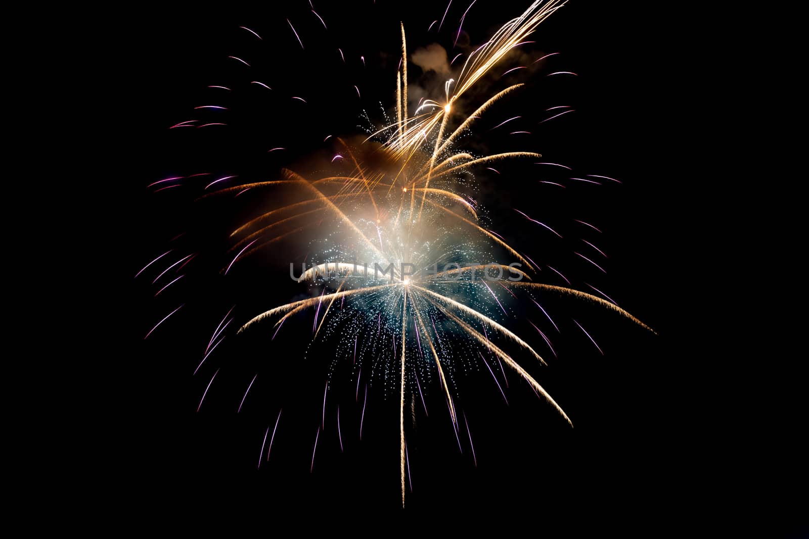 Purple or Violet with Yellow Sparkling Fireworks Background on Night Scene. Abstract color fireworks background and smoke on sky
