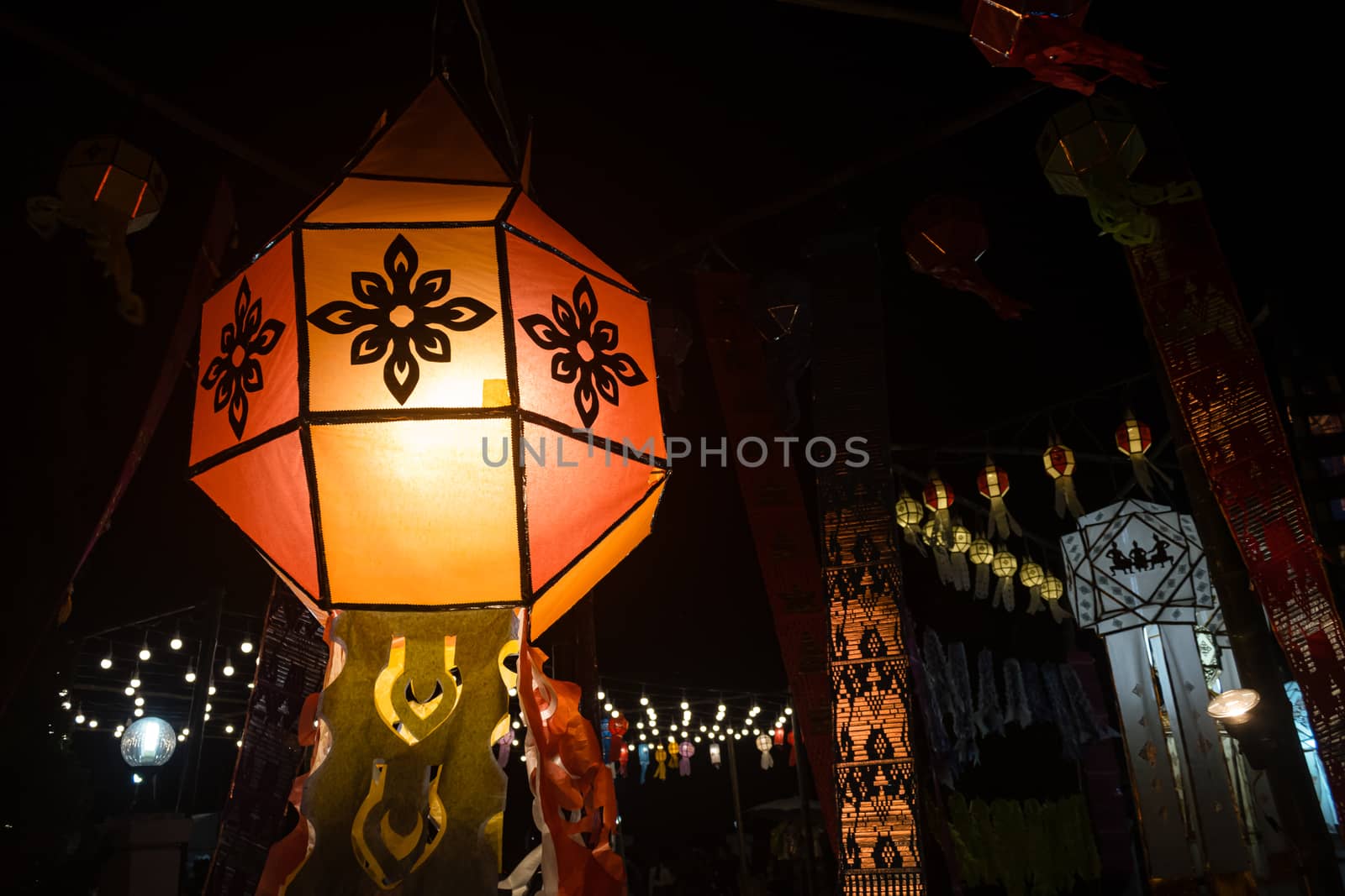 Orange Paper lanterns in Loi Krathong festival on Left Frame. Lanterns contest in Loi Krathong festival at Phayao Thailand