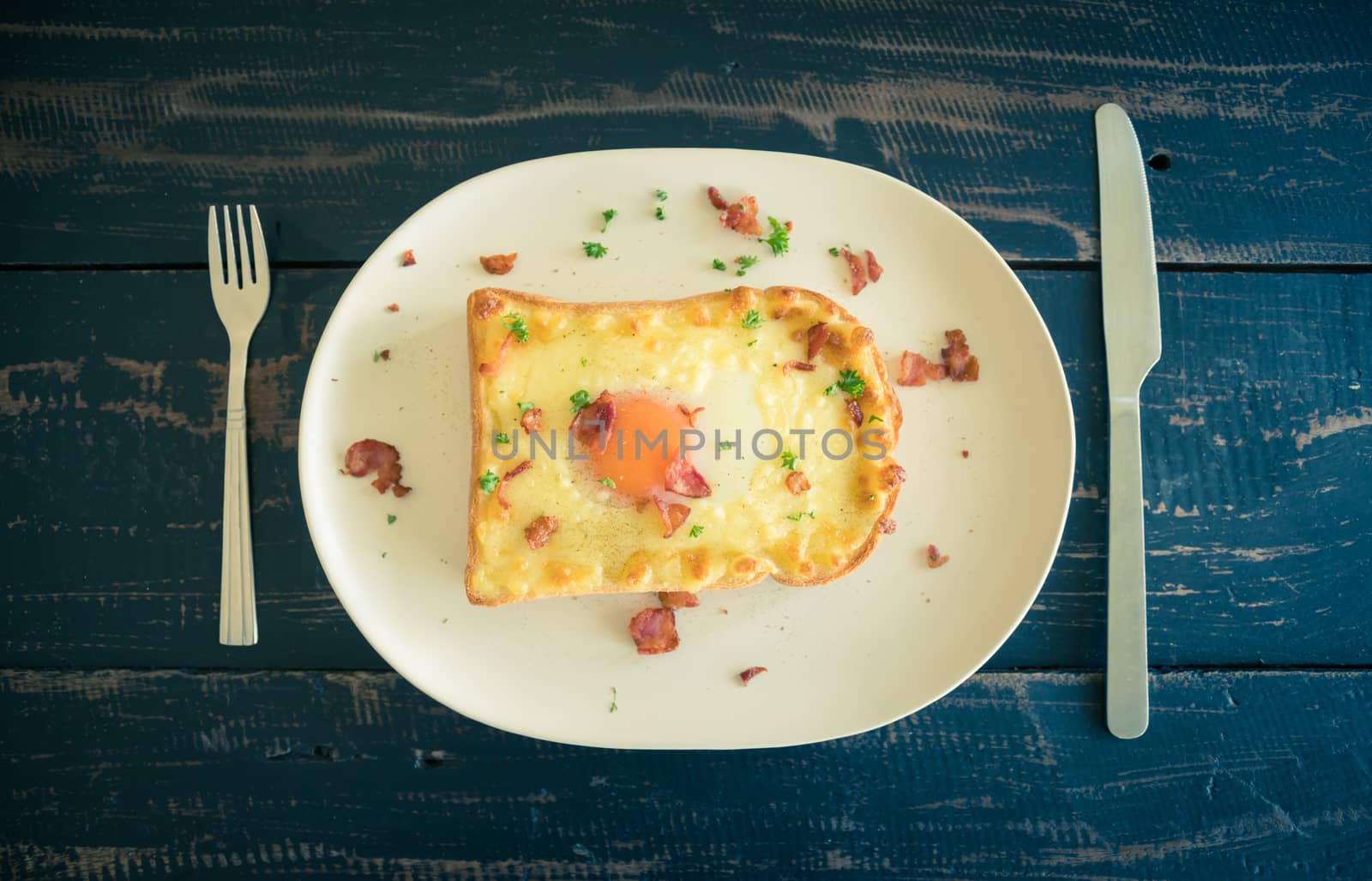 Egg Yolk Bacon Ham Cheese Bread Toast and Coriander for Breakfas by steafpong