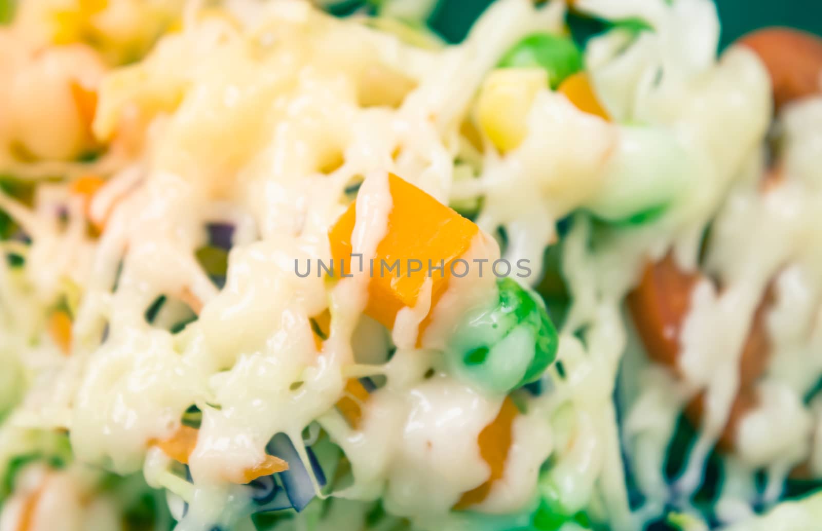 Healthy Salad include Carrot and Corn and Peas and Tomato and Cabbage with Mayonnaise Topping with Natural Light in Close Up View in Vintage Tone