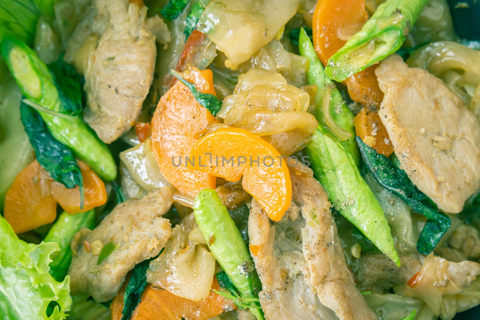 Stir Fried Noodle and Pork and Carrot and Yardlong Beans and Lettuce with Black Soy Sauce on Flatlay View with Natural Light in Close Up View in Vintage Tone